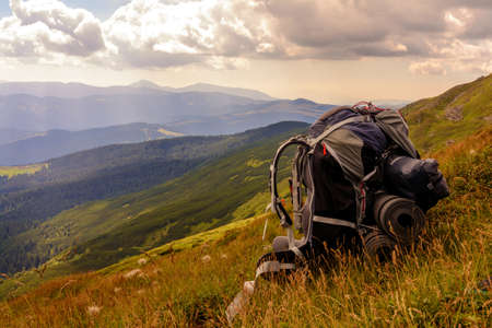 Backpack, the main element or thing in the campaign, a backpack on the background of the Carpathian...
