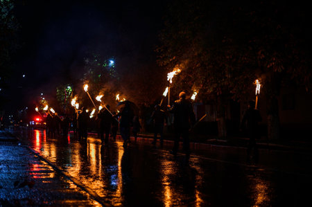 Night torch, bright torch lights on the streets of the night city. 2020 Group of protesters
