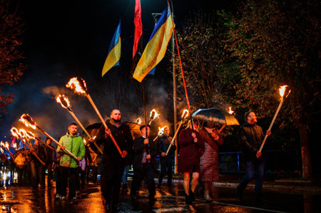 Many people walk through the night city with torches in their hands. Dolyna, Ukraine: October 14, 2020 rally of the political party Svoboda.2020のeditorial素材