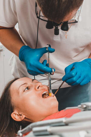 Local anesthesia, dentist carpal syringe injects the patient's gum anesthesia, dental carpule...