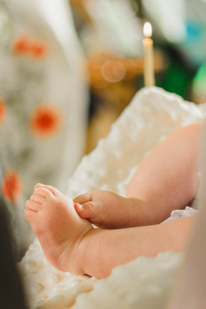 Baptism of a baby, close up of tiny baby feet, sacrament of baptism. 2020の写真素材
