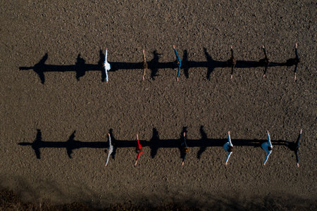 A group of children stand on the road, resulting in shadows, top view. 2020の写真素材