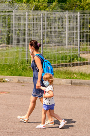 lviv, ukraine June 29, 2020: mother and child walk the streets of Lviv during a pandemic. 2020のeditorial素材