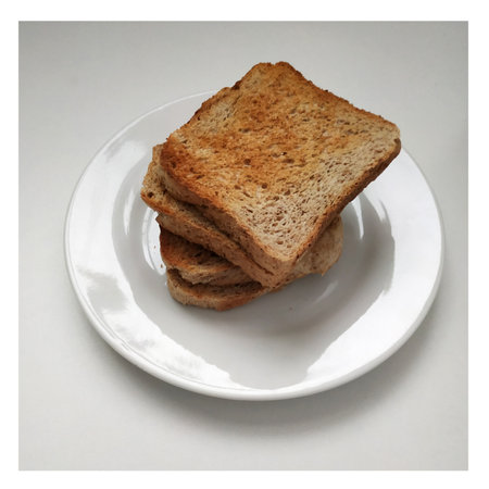 Square crispy and fragrant toast on a white plate, toast for breakfast. 2021の写真素材