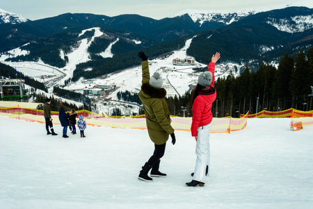 Bukovel, Ukraine February 3, 2019: vacation in Bukovel, girls on the background of a new ski resort in Ukraine.のeditorial素材