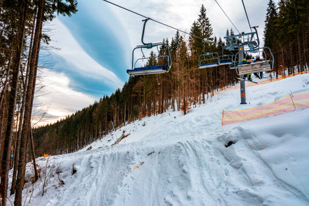 Bukovel, Ukraine February 3, 2019: cable car for skiers and tourists in Bukovel, mountain landscapes.newのeditorial素材