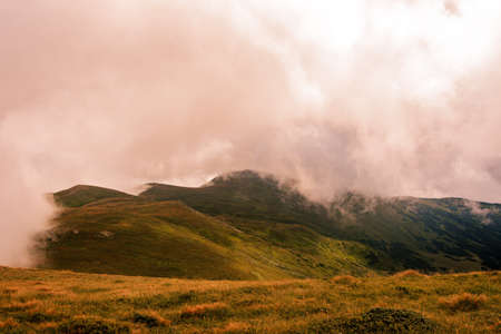 Magical overcast landscape of the Montenegrin ridge in the Carpathians, picturesque landscapes from Gutin Tomnatych, the Carpathians after the summer morning rain. 2020の写真素材