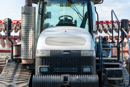 Dolyna, Ukraine April 29, 2020: agro-industrial machinery will cultivate the fields, a tractor of a challender company on caterpillars, an agricultural firm Khortytsia.newのeditorial素材