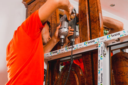Dolyna, Ukraine July 31, 2020: installation of a window frame and windows in the house, windows from the wds company.newのeditorial素材