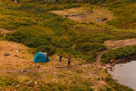 Tourists near Lake Brebeneskul in the Carpathians, trails to the lake. newの写真素材