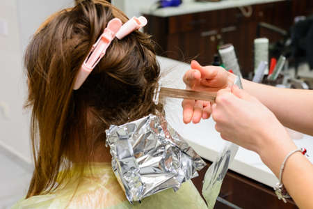 Beginning of hair coloring, coloring technique balayag, hair bleaching for applying paint. new
