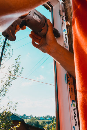 Dolyna, Ukraine July 31, 2020: installation and replacement of a plastic window, windows from wds, plastic window frame.newのeditorial素材