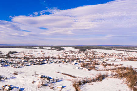 Ukrainian village in winter, panorama of snow-covered village, view of the village from above,...