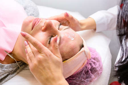 Facial massage at the beautician at the reception, visiting a beauty salon, a sense of relaxation....