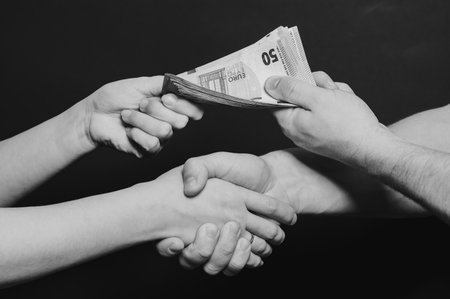 People's consent, the transfer of money from hand to hand, the European currency in the market. newの写真素材