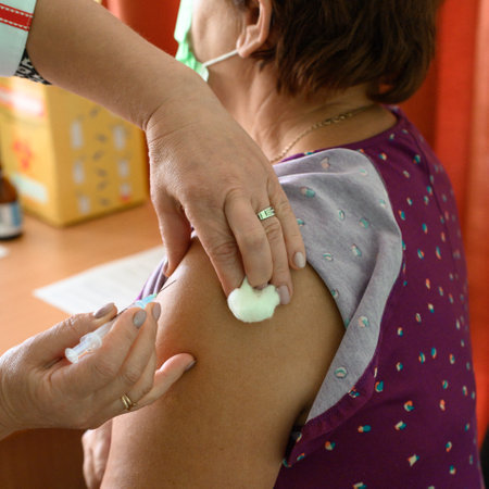 Close up of vaccination, injection of vaccine in hand, epidemic and ways to overcome, clinic.の写真素材