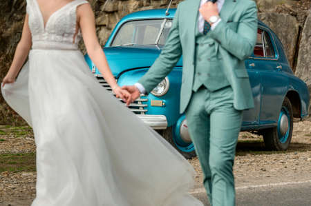 a walk of brides in the mountains, a photo shoot with a retro car.の写真素材