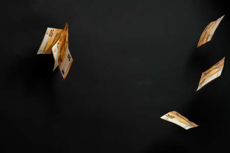 European banknotes on a black background, rain of money, human investment in currency. newの写真素材