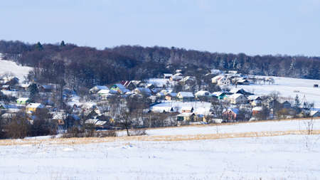 Ukrainian snow-covered villages, panorama of winter and evening villages, Carpathian villages in Ukraine.の写真素材