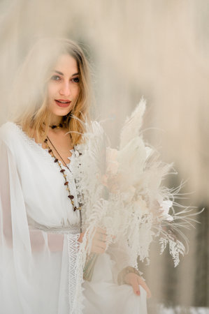 Vorokhta, Ukraine March 31, 2021: portrait of the bride, vivid and magical emotions, winter.のeditorial素材
