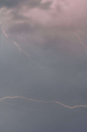 Bright lightning before the storm, the sky covered with rain clouds and lightning, cloudy sky.