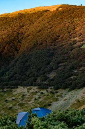 The top of the Carpathian mountain Hoverla, a magical autumn dawn at the foot of the mountain,autumn...