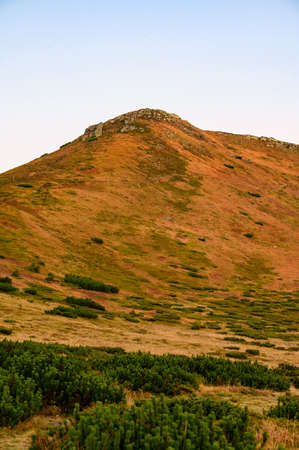 The top of the Carpathian mountain Turkul, a magical autumn dawn at the foot of the mountain, autumn...