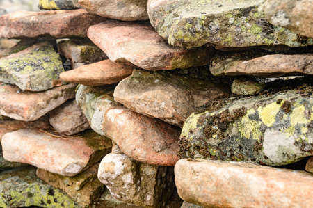 rock in the fog, texture of rock with moss, flat stones in the mountains.