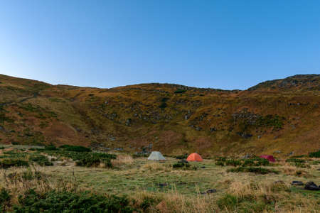 Tent camp near Lake Nesamovyto, morning in a camp town in the mountains, autumn tourism.の写真素材