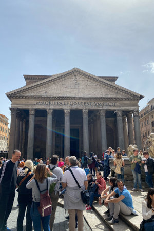 Many tourists gathered at lunchtime near magrippalfcostertivmfecit. Pantheon in Rome, Italy April 23, 2022.のeditorial素材
