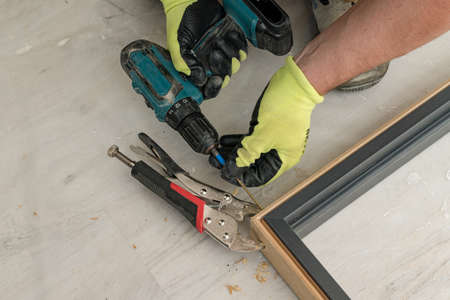 Drilling a hole in the door frame for a corner connection, installation of interior doors.