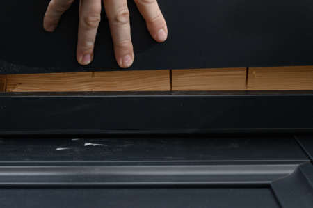 Checking the door frame for evenness of the surface after installation with a metal rule, installing...