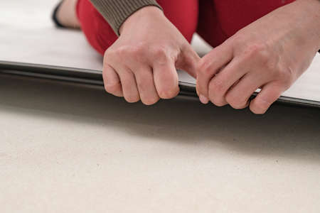 Floor installation, a new style of quartz vinyl floor, repair work to install the floor, a woman...