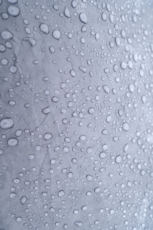 Raindrops on blue tent close-up, water droplets on tent after rain. Foggy morning in the Carpathians.の写真素材