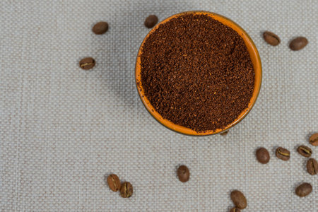 coffee beans, ground coffee in cups on a linen background, an aromatic drink that causes addiction.の写真素材