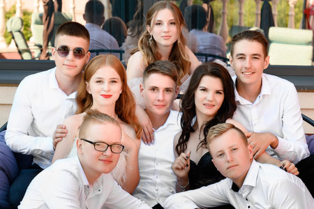 Portrait of a group of young teenagers in elegant clothes, classically dressed teenagers, prom.のeditorial素材