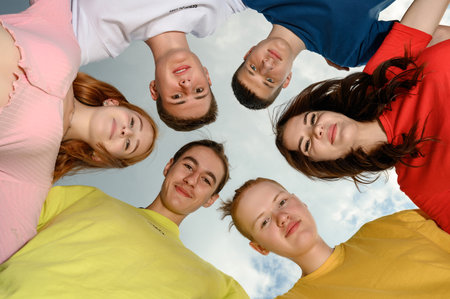 Ivano-Frankivsk, Ukraine, July 14, 2022: happy children made a circle with their heads, bright colors of children's clothes.のeditorial素材