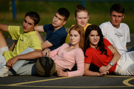 Ivano-Frankivsk, Ukraine July 14, 2022: portrait of a group of teenagers on a sports field, photo of children with a ball.のeditorial素材