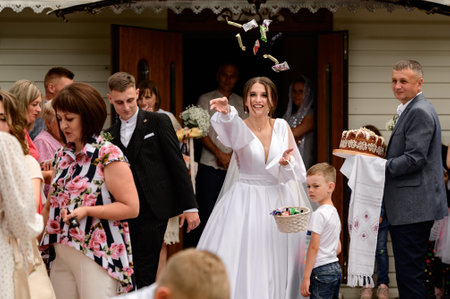The newlyweds walk through the churchyardのeditorial素材
