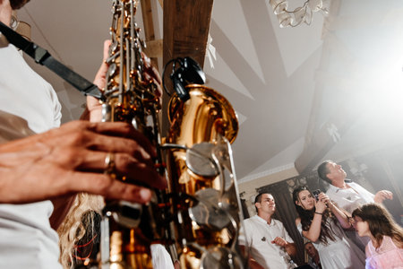 Ivano-Frankivsk, Ukraine August 1, 2021 :Musical instruments at a wedding close-up, musician with saxophone close-up.のeditorial素材