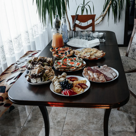 Exquisite festive table with sweets and fruits, celebration and treat with sweets.の写真素材