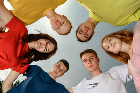 Ivano-Frankivsk, Ukraine, July 14, 2022: happy children made a circle with their heads, bright...