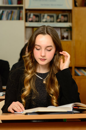 Ivano-Frankivsk, Ukraine June 15, 2021: portrait of a student sitting at a desk, students in black clothes.のeditorial素材