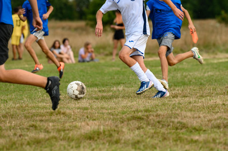 Ivano-Frankivsk, Ukraine July 25, 2021: football competitions in Ukrainian villages between schoolchildren, an entertaining summer sports program for children in the village.のeditorial素材