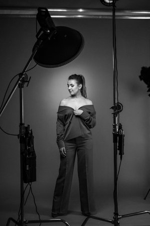 Ivano-Frankivsk, Ukraine January 30, 2022: portrait of a girl in the studio in full height, black...