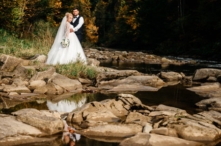 Ivano-Frankivsk, Ukraine October 2, 2021: bridal walk in the autumn mountains, a walk by the river.のeditorial素材