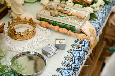 Church throne, crown with wedding rings and water for consecration, details for the wedding of the...