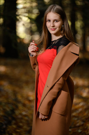 Ivano-Frankivsk, Ukraine October 14, 2022: portrait of a schoolgirl in the autumn forest, beautiful portrait of a girl.のeditorial素材