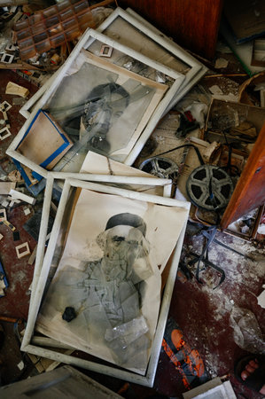 Kyiv, Ukraine July 1, 2022: old broken photos between paints and magnetic photo tapes, historical destroyed photos.のeditorial素材