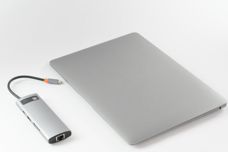USB adapter connected to laptop with different inputs for flash drive, hdmi, ethernet, memory card,...